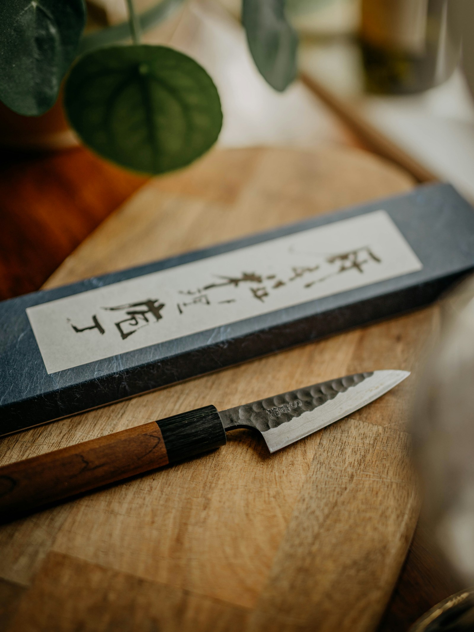 A knife resting on a wooden board
