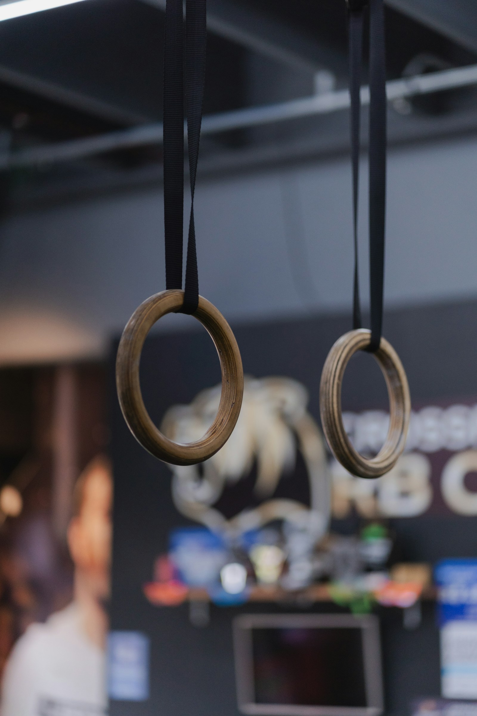 Two wooden gymnastic rings hanging still
